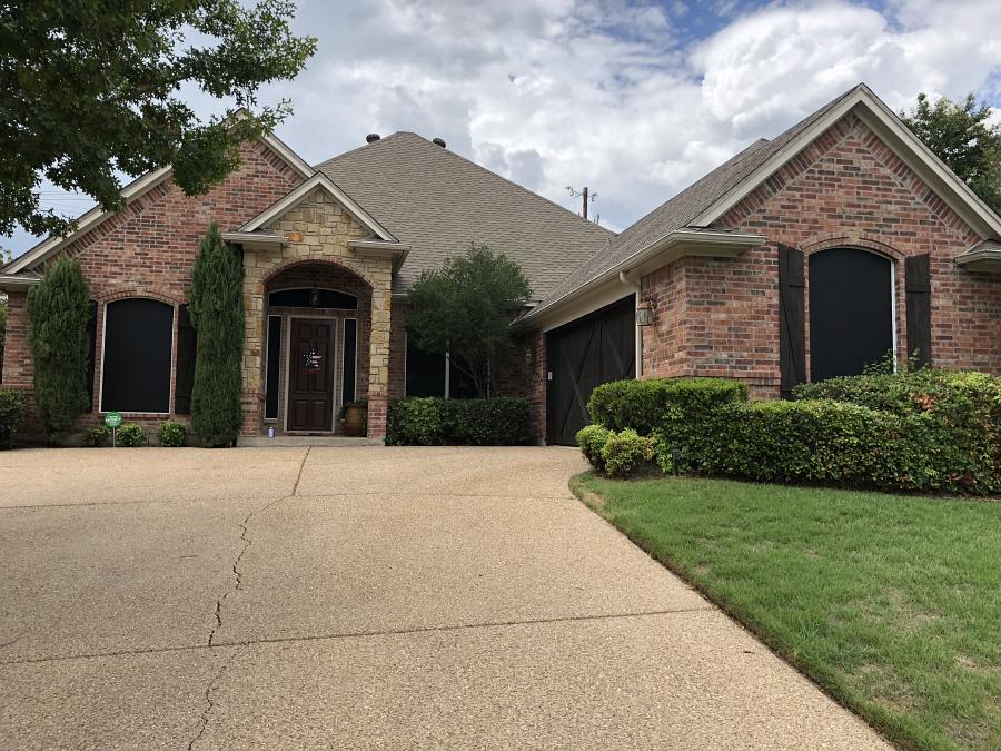 Solar screens installed on a home by Weatherford Glass